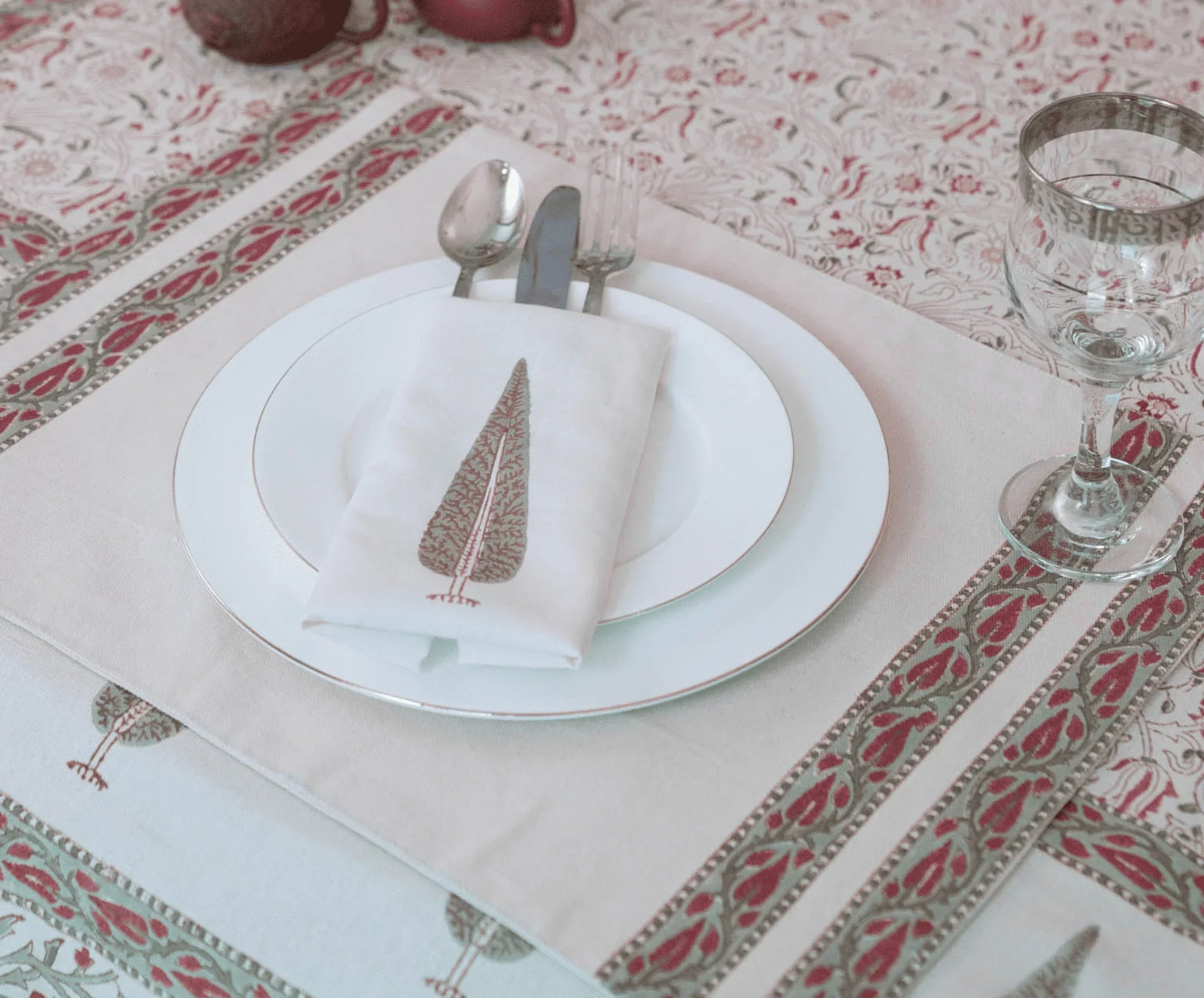 Handcrafted Pakistani block print tablecloth, napkin, and placemat set with elegant dinnerware